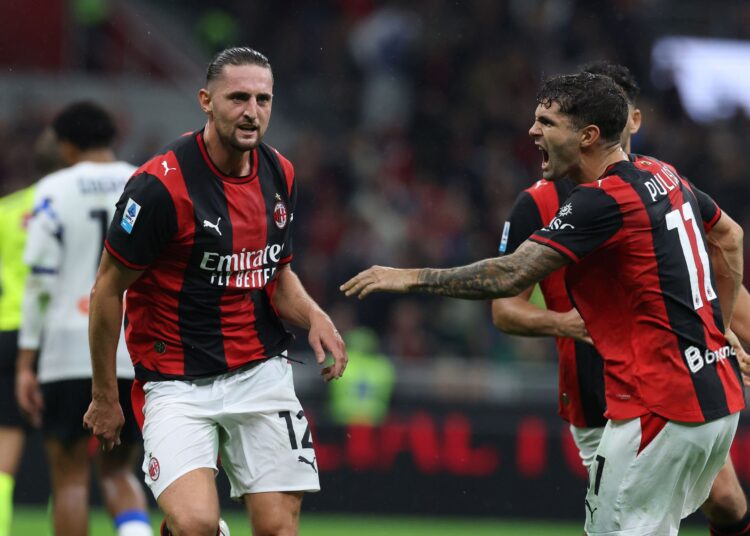 Adrien Rabiot and Christian Pulisic celebrate during AC Milan - Atalanta match