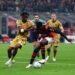 Sankhoun Diawara of AC Milan battles for the ball with Samuel Mbangula of Bologna FC