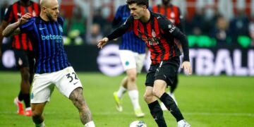 Christian Pulisic of AC Milan competes for the ball with Federico Dimarco of Inter