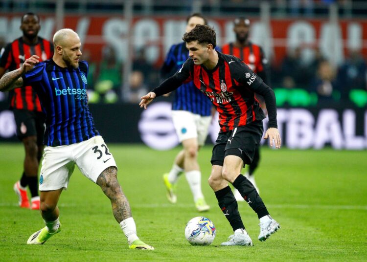 Christian Pulisic of AC Milan competes for the ball with Federico Dimarco of Inter