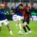 Christian Pulisic of AC Milan competes for the ball with Federico Dimarco of Inter