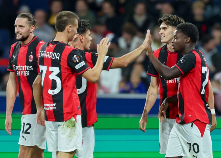 Alphadjo Cisse and AC Milan players