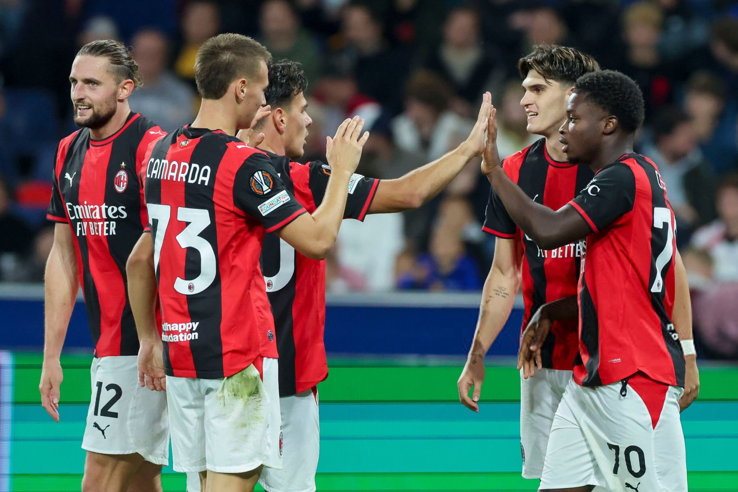 Alphadjo Cisse and AC Milan players