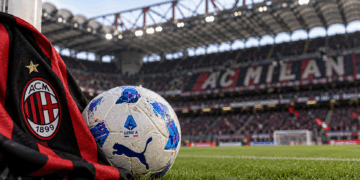 AC Milan scarf and Serie A football at San Siro Stadium.