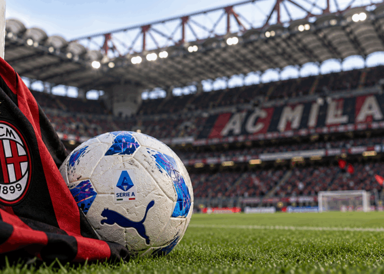 AC Milan scarf and Serie A football at San Siro Stadium.