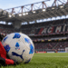 AC Milan scarf and Serie A football at San Siro Stadium.